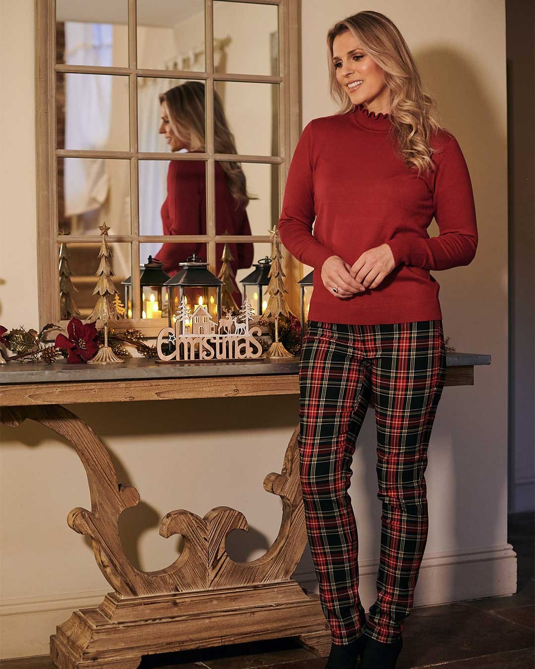 Red jumper and black tartan trousers christmas outfit idea
